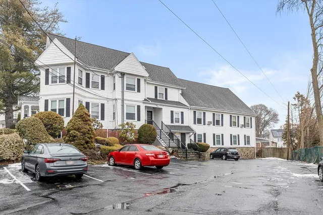 a front view of a house with parking space