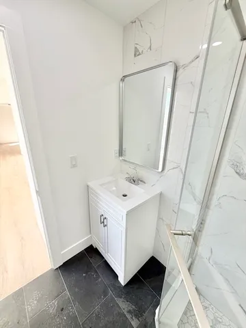 a utility room with a sink washer and dryer