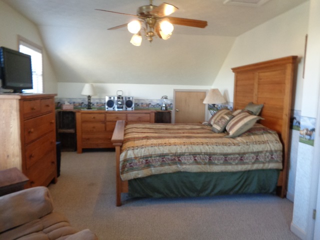 324 Craig Shop Road Mount Sidney, VA 24467 - Photo 16 of 28 a bedroom with a bed and furniture