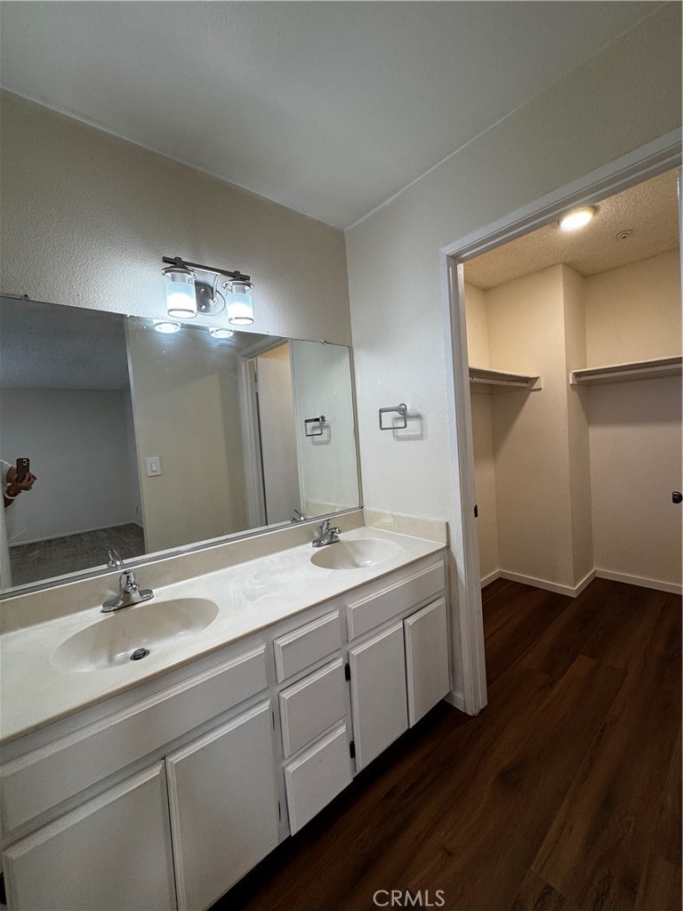 3930 Maxson, Unit F El Monte, CA 91732 - Photo 3 of 14 a bathroom with a double vanity sink and a mirror