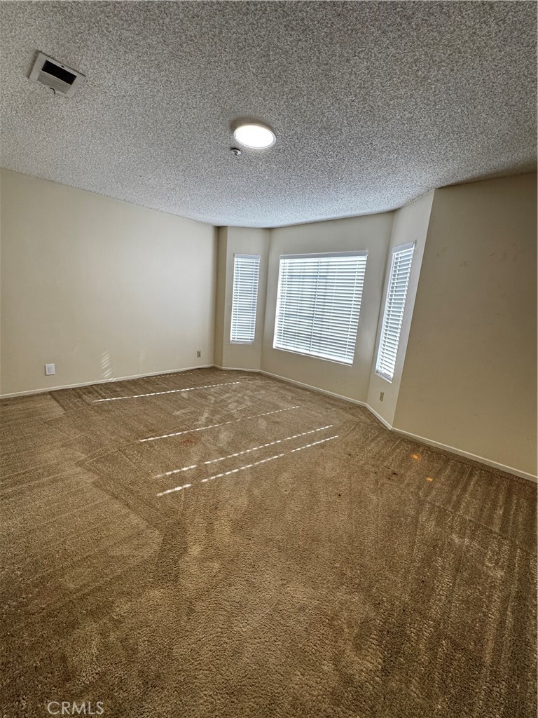 3930 Maxson, Unit F El Monte, CA 91732 - Photo 6 of 14 an empty room with windows
