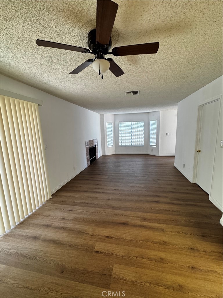 3930 Maxson, Unit F El Monte, CA 91732 - Photo 9 of 14 a view of an empty room with a window and wooden floor