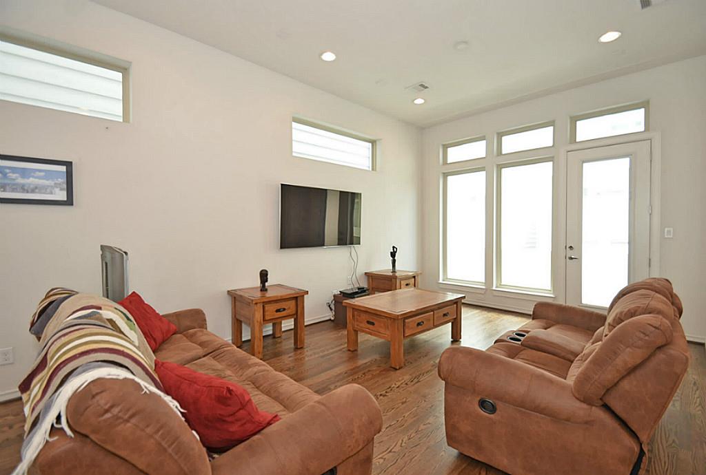 2713 Clay Street Houston, TX 77003 - Photo 3 of 24 Open & inviting living area with gorgeous wood floors.