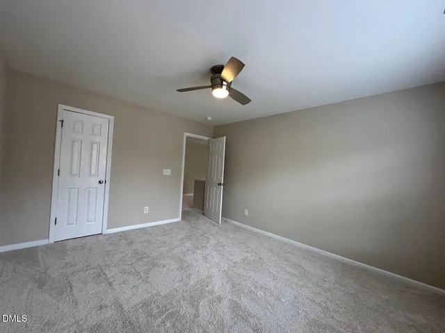 an empty room with a empty space and windows