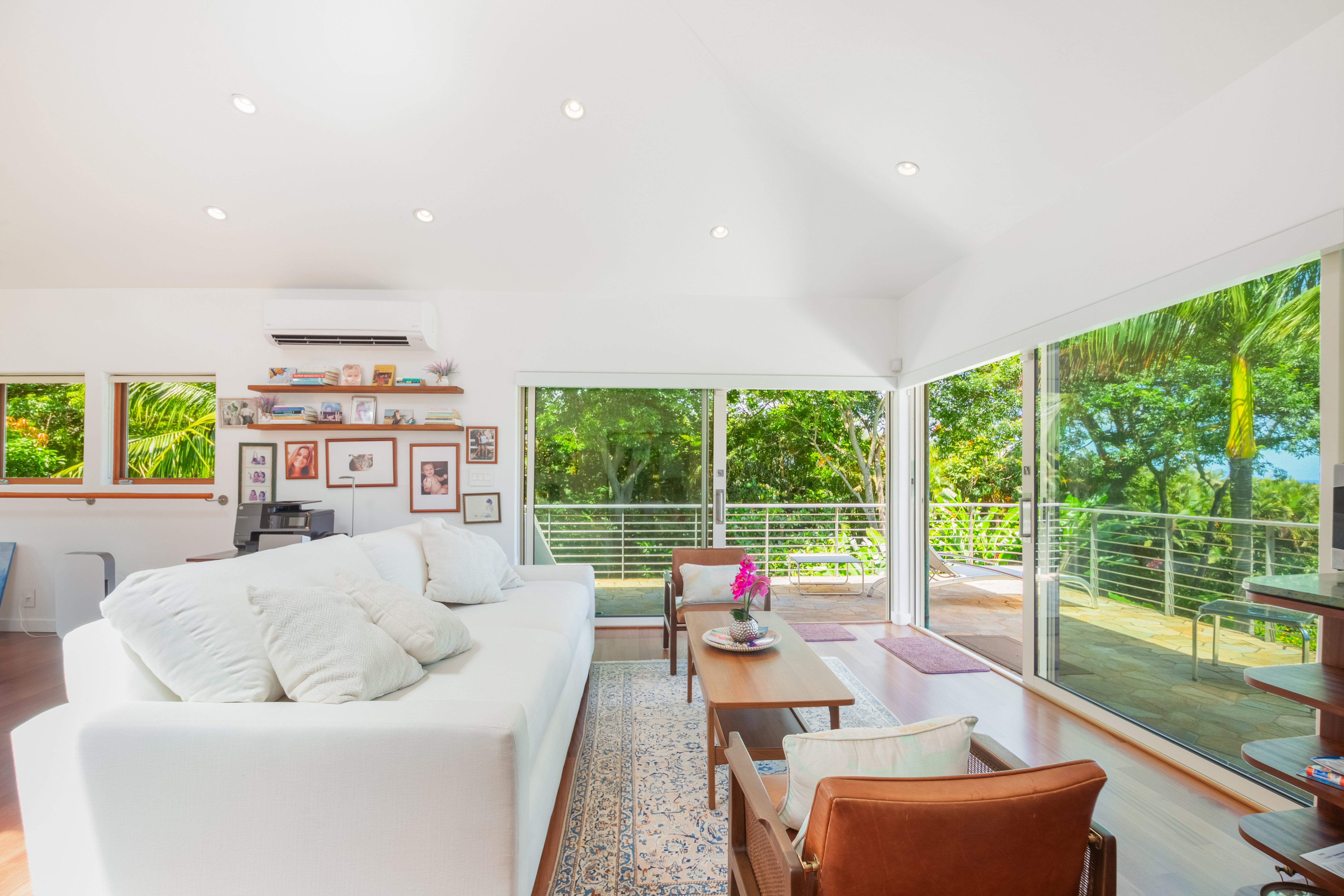 2874 A Kauapea Road Kilauea, HI 96754 - Photo 18 of 30 a living room with furniture and a floor to ceiling window