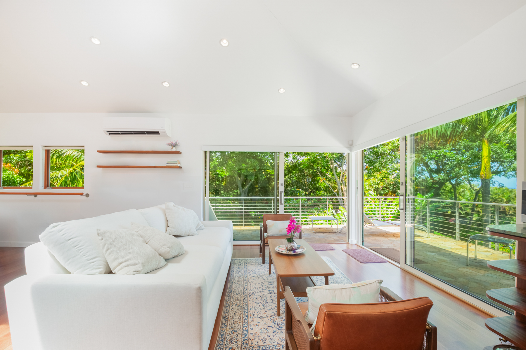 2874 A Kauapea Road Kilauea, HI 96754 - Photo 20 of 30 a living room with furniture and a floor to ceiling window