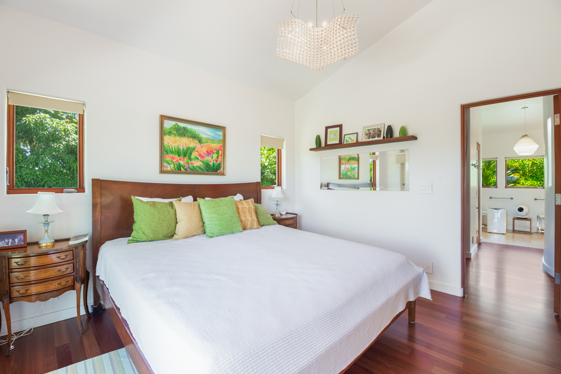 2874 A Kauapea Road Kilauea, HI 96754 - Photo 23 of 30 a large white bed in a bedroom next to a window