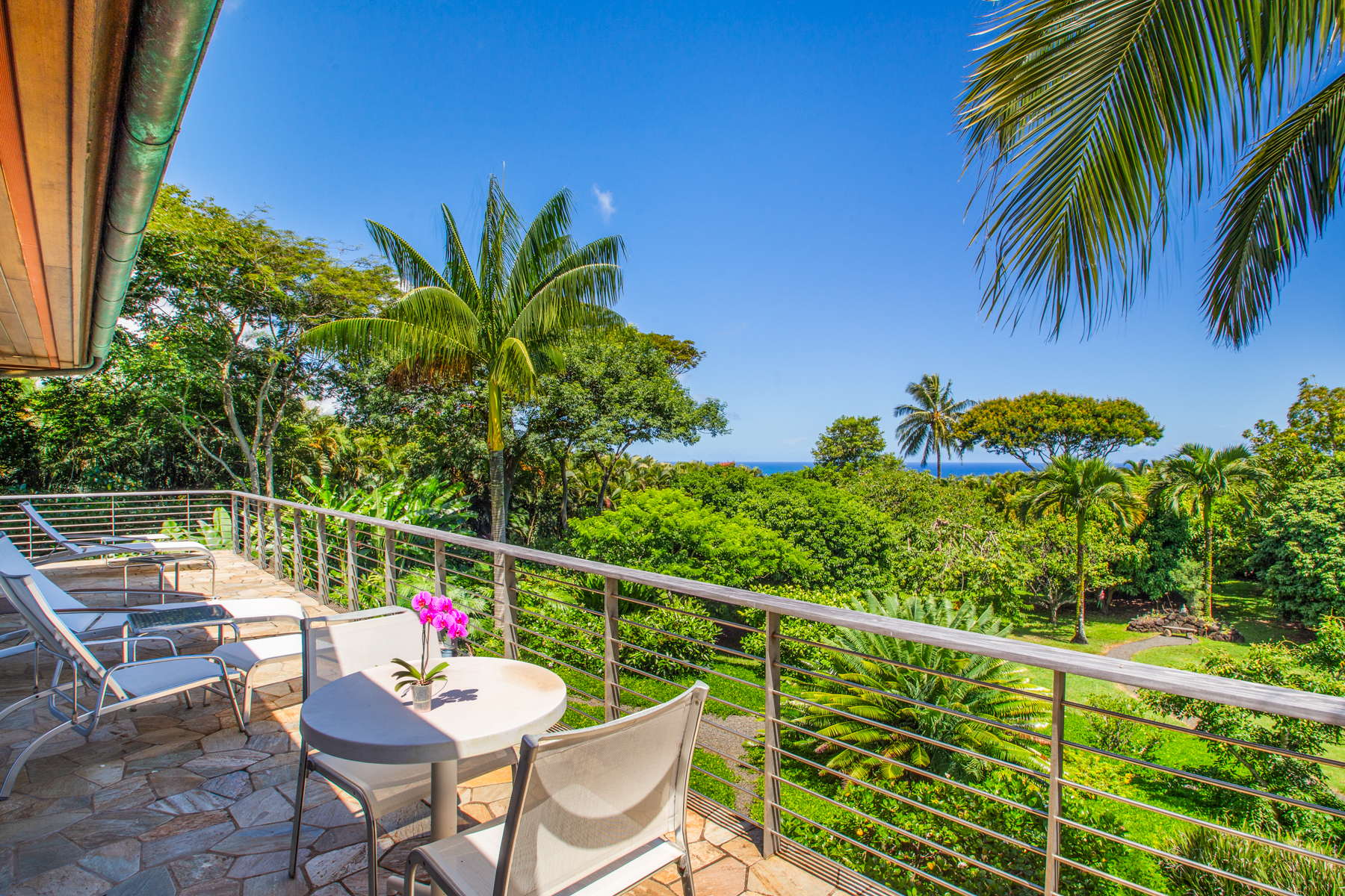 2874 A Kauapea Road Kilauea, HI 96754 - Photo 24 of 30 a view of a chairs and table in the balcony