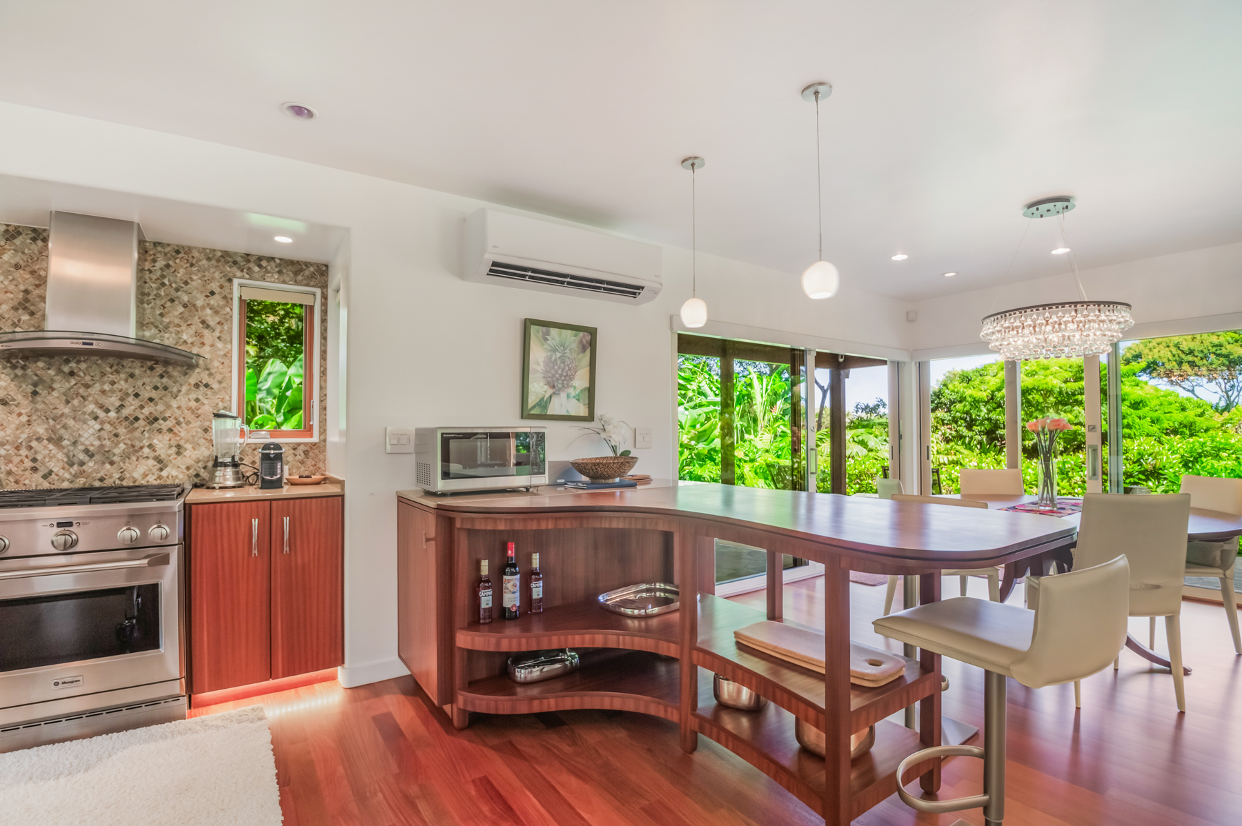 2874 A Kauapea Road Kilauea, HI 96754 - Photo 10 of 30 a kitchen with granite countertop a stove and a wooden floors