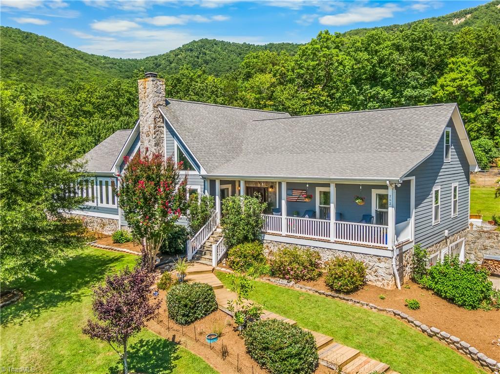 Front corner view of 252 Bear Trl. Behind the home is 2000+ acres owned by Piedmont Land Conservancy.
