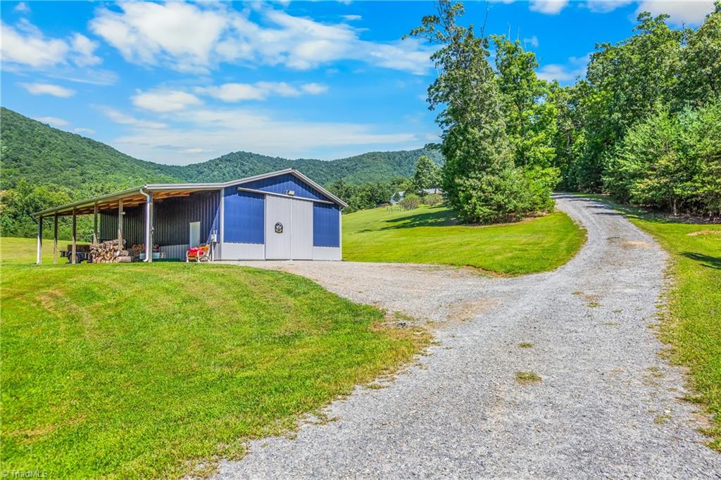 246 Bear Trail Lowgap, NC 27024 - Photo 27 of 50 Barn has power, workshop that is heated and cooled and RV hook up!