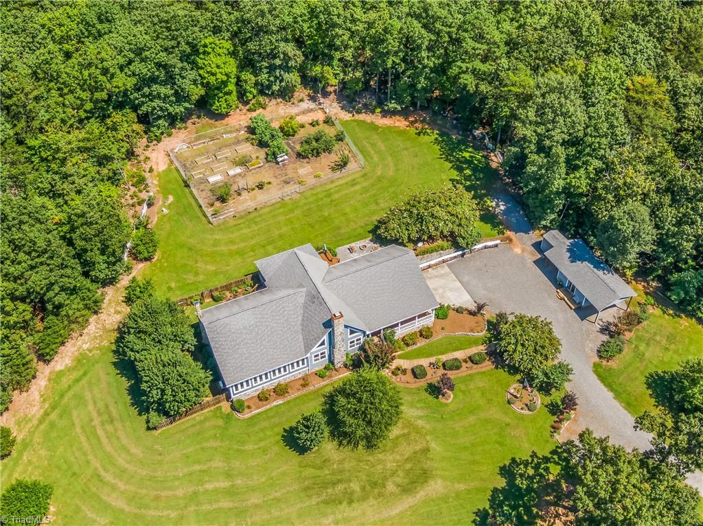 246 Bear Trail Lowgap, NC 27024 - Photo 5 of 50 Overhead view 252 Bear Trl. Large fenced in garden area behind the home. Studio building to the right of the home.