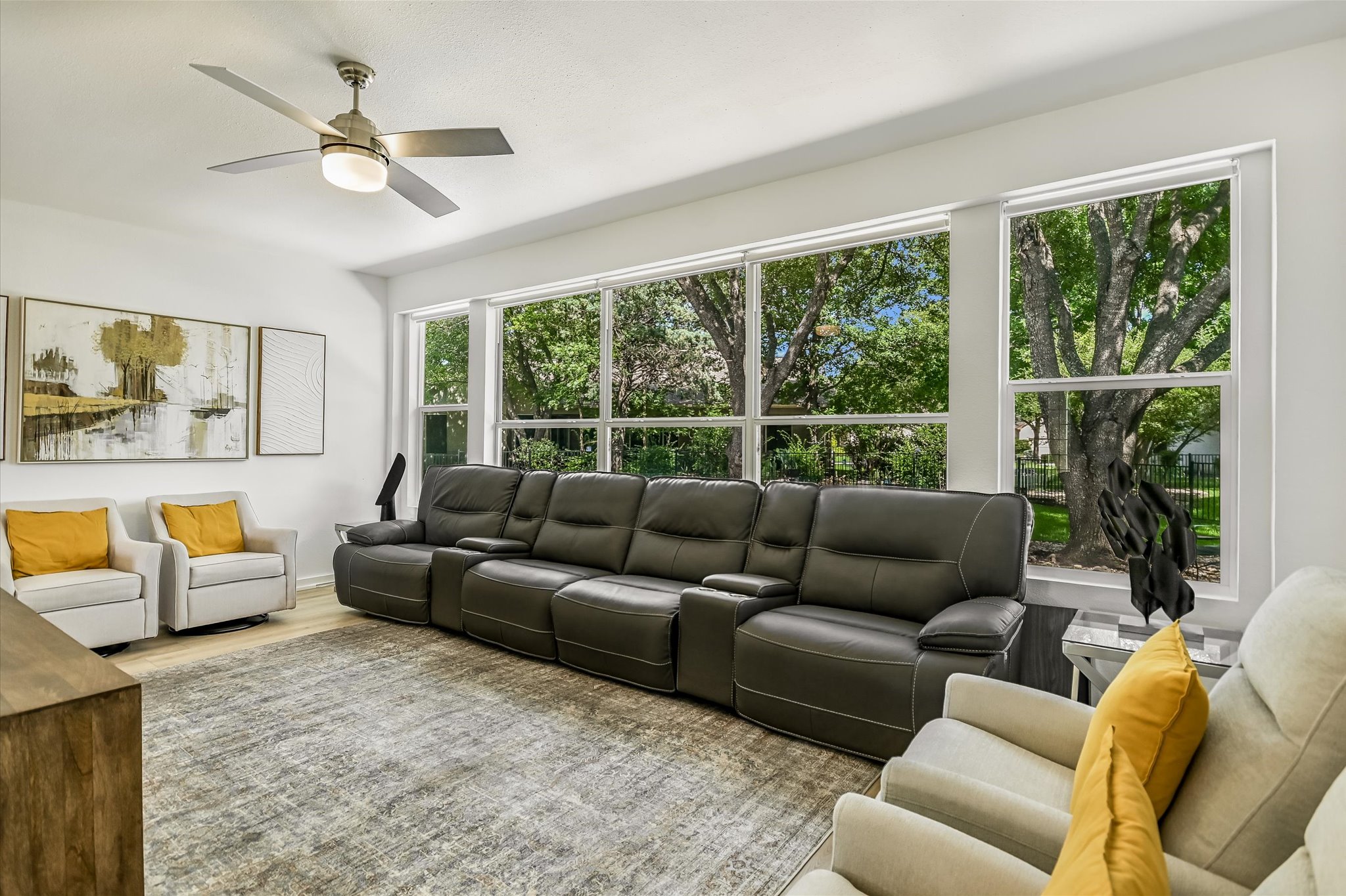 105 Stetson Circle Georgetown, TX 78633 - Photo 6 of 21 A wall of windows draws natural light into the space. Window shades offer privacy when desired.