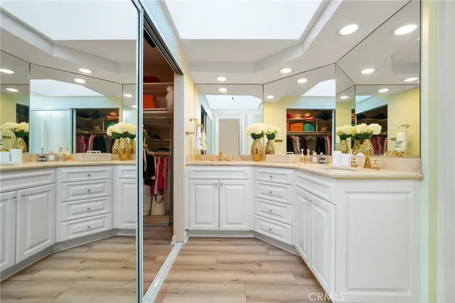 a kitchen with kitchen island granite countertop a sink and cabinets