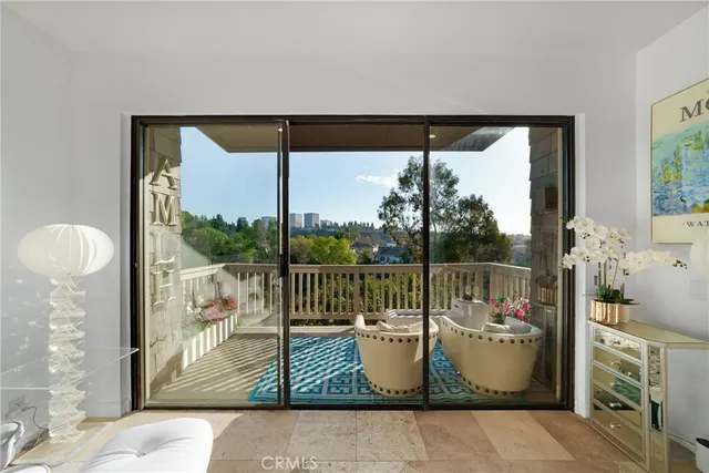 a view of a balcony with furniture