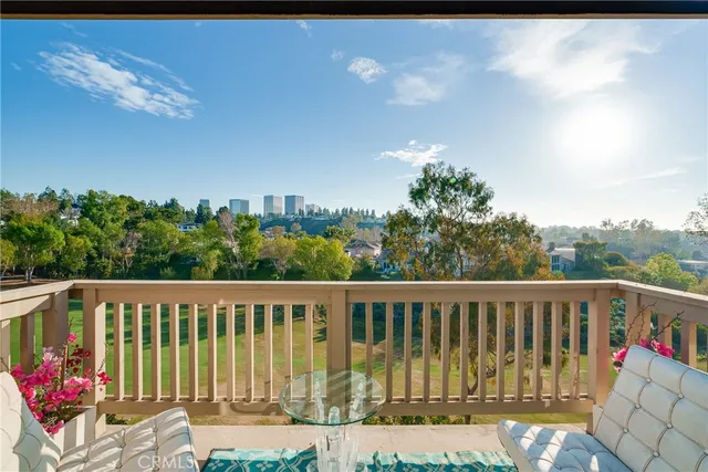 a view of a balcony with wooden floor