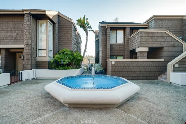 a view of a house with pool and yard
