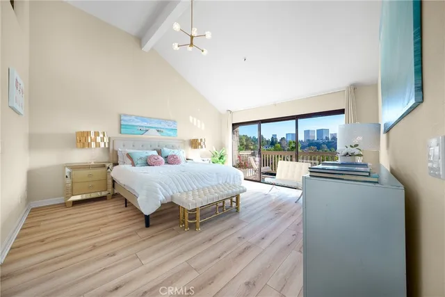 a spacious bedroom with a bed and a large window