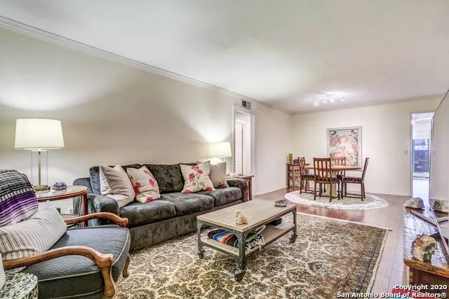 a living room with furniture and a rug