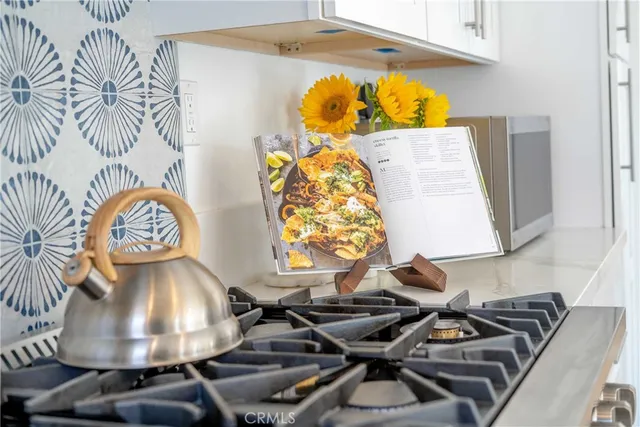a view of a swimming pool with a window and couch