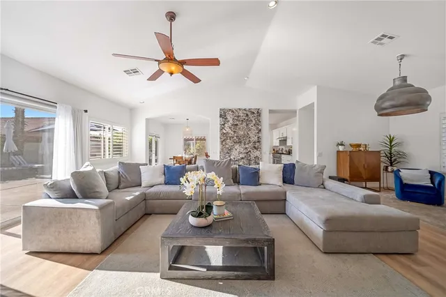 a living room with furniture and a window