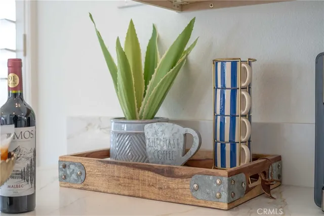 a view of living room with furniture and a potted plant