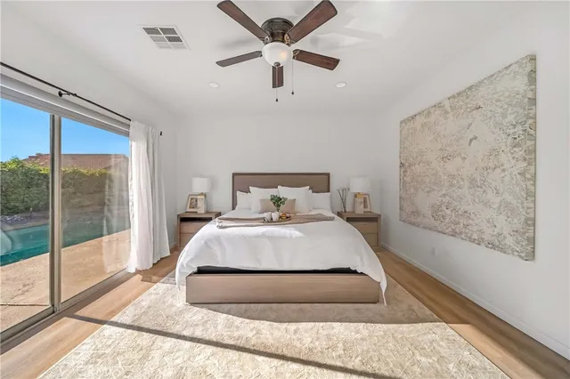 a bedroom with a bed and window