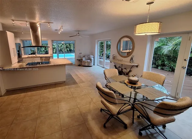 a living room with furniture a window and a table