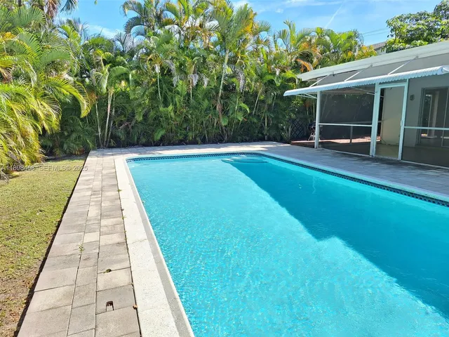 a view of swimming pool with a patio