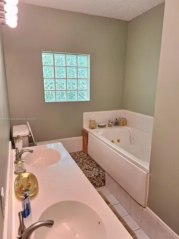 a bathroom with a sink and a window