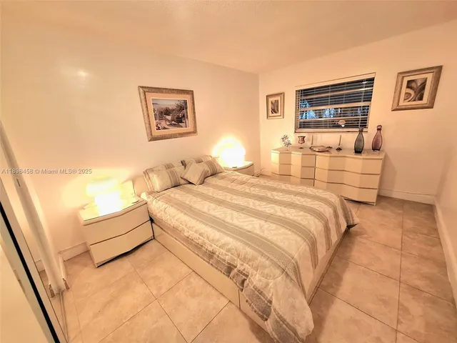 a bedroom with a bed and a cabinets