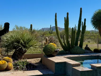 a bathroom with a sink toilet vanity and shower