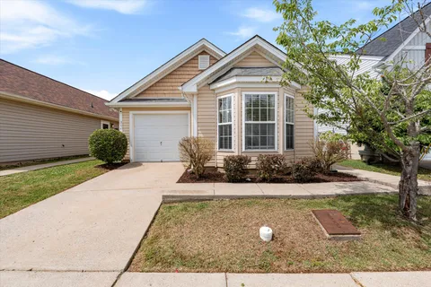 a front view of a house with yard