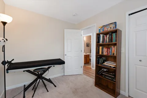 a room with furniture and a book shelf