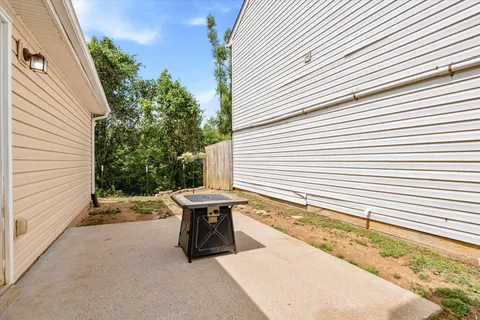 a view of a backyard with sitting area
