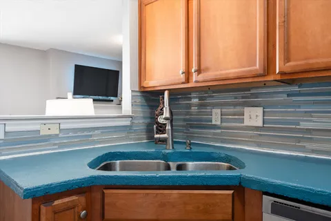 a kitchen with a sink and a window