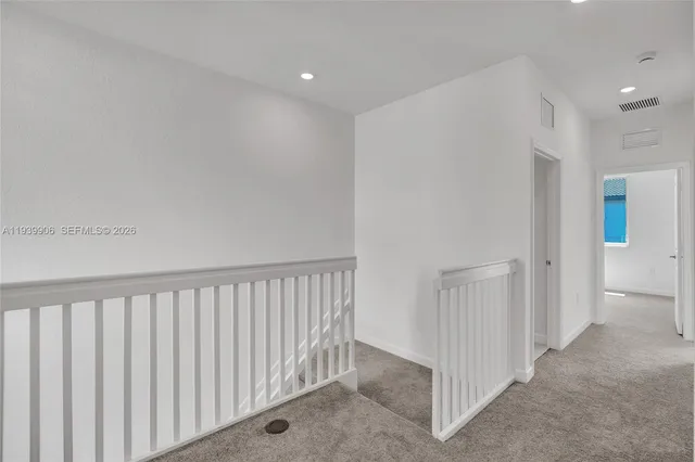 an empty room with closet area