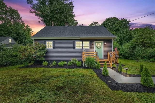 a front view of a house with garden