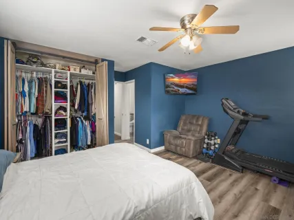 a bed room with a bed and a chandelier