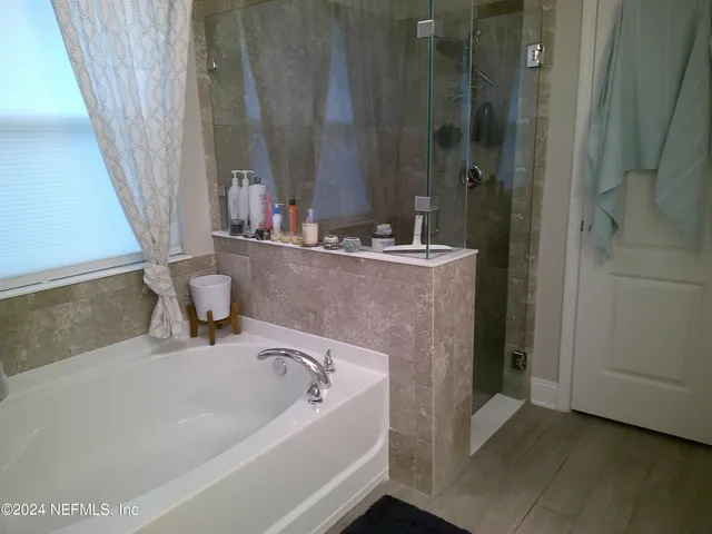a bathroom with a bathtub and a sink