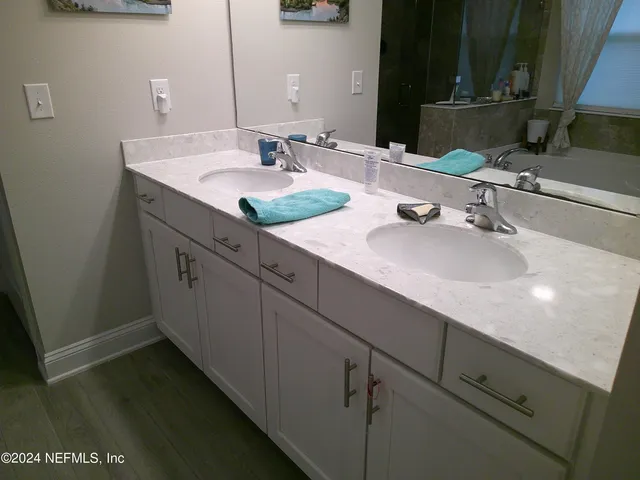 a bathroom with a sink and a mirror