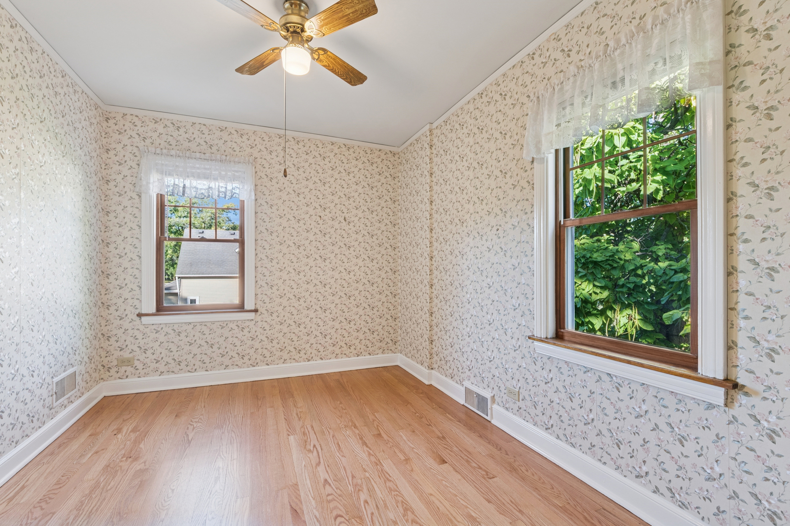 1850 Pine Road Homewood, IL 60430 - Photo 13 of 20 a view of an empty room with wooden floor and a window