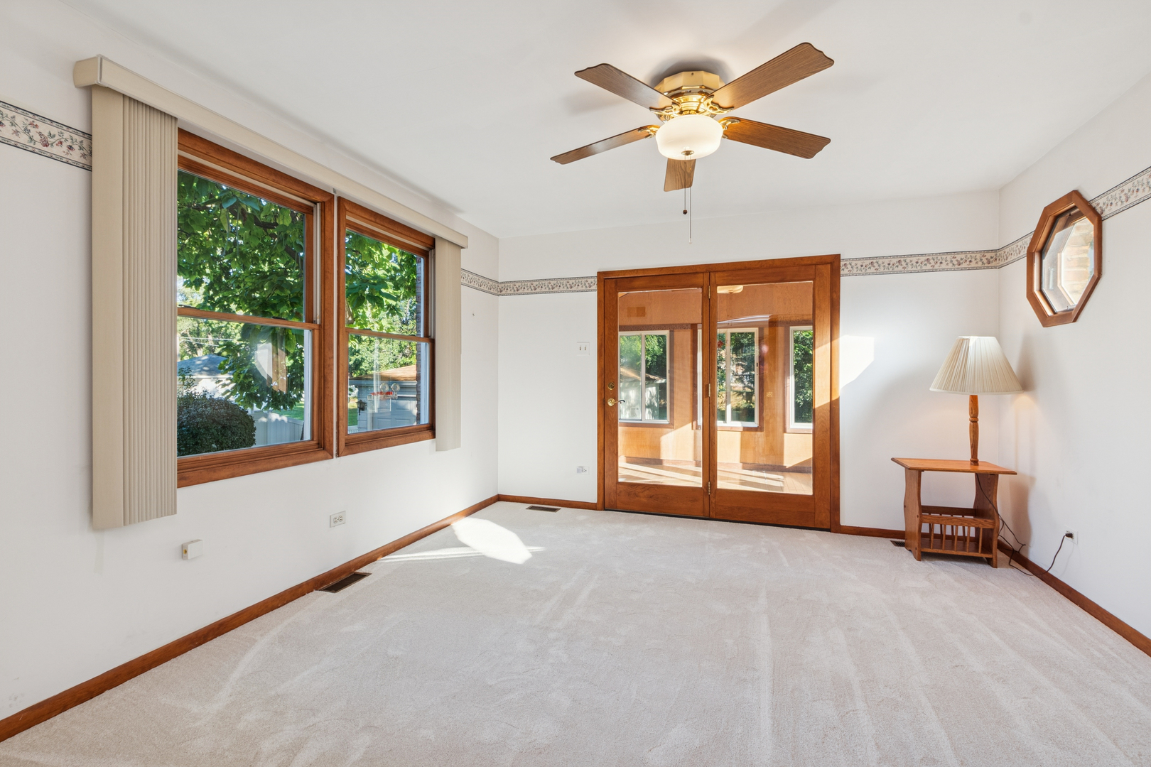 1850 Pine Road Homewood, IL 60430 - Photo 4 of 20 a furnished livingroom with windows and chandelier fan