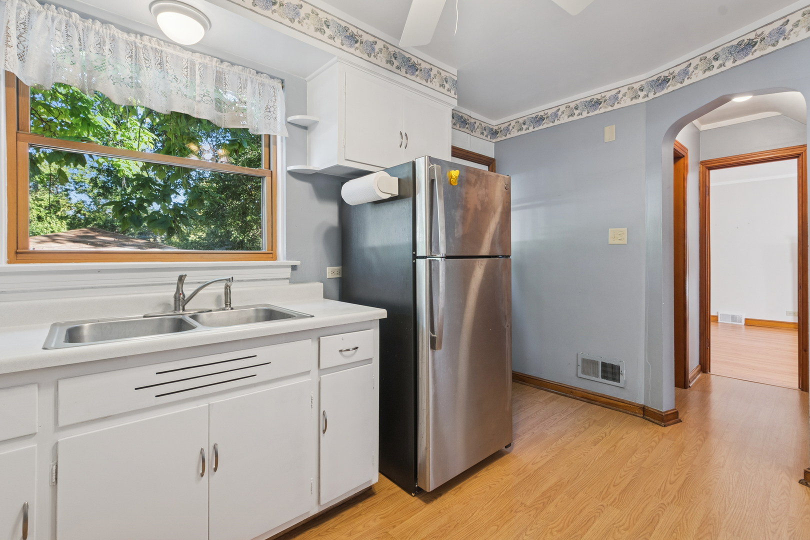 1850 Pine Road Homewood, IL 60430 - Photo 7 of 20 a kitchen with a refrigerator sink and cabinets