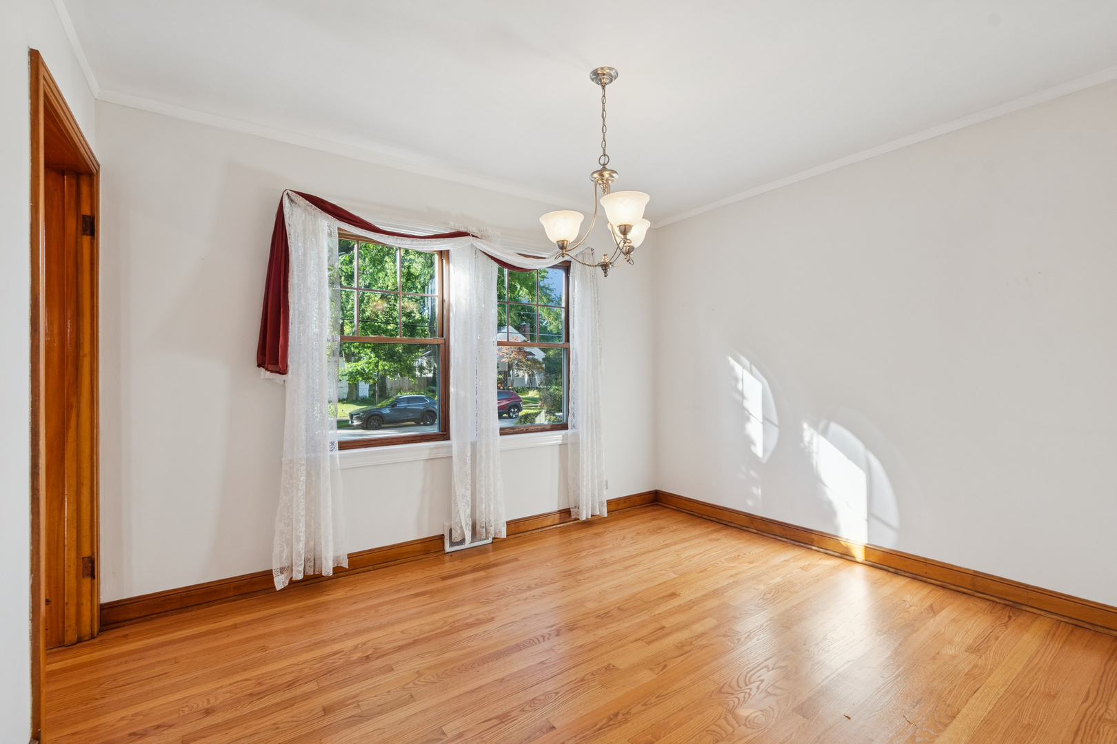 1850 Pine Road Homewood, IL 60430 - Photo 8 of 20 a view of empty room with wooden floor and fan