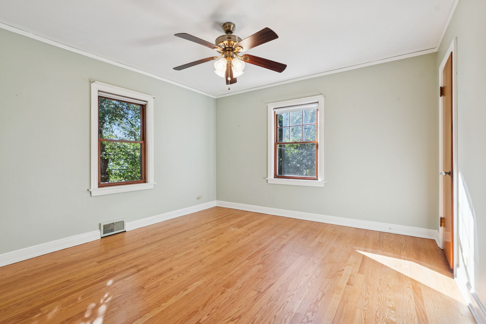 1850 Pine Road Homewood, IL 60430 - Photo 10 of 20 a view of an empty room with window and wooden floor