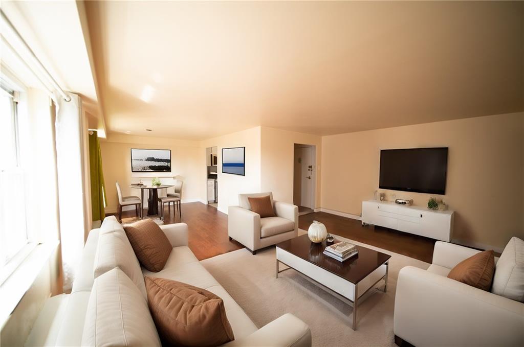 4625 Fifth Avenue, Unit 408 Pittsburgh, PA 15213 - Photo 11 of 34 a living room with furniture and a flat screen tv
