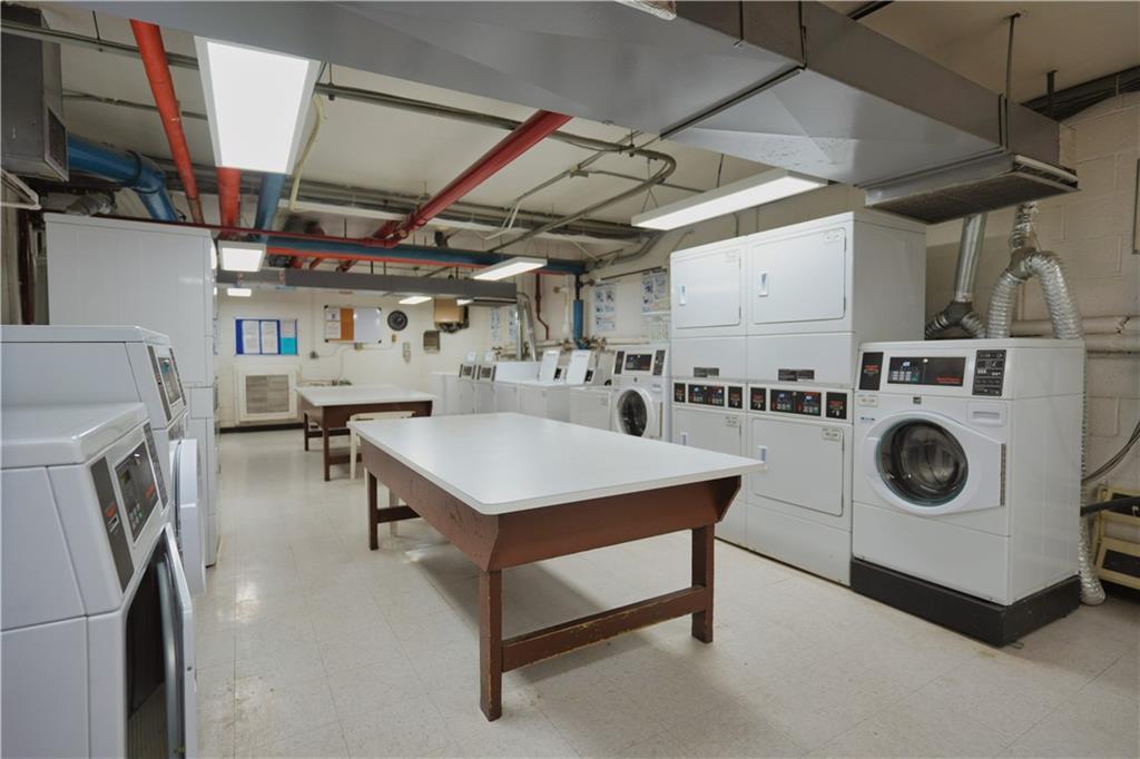4625 Fifth Avenue, Unit 408 Pittsburgh, PA 15213 - Photo 29 of 34 a utility room with dryer washer and stair