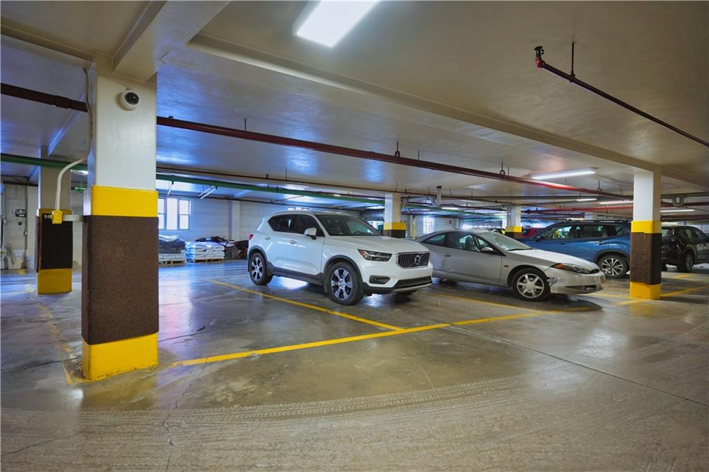 4625 Fifth Avenue, Unit 408 Pittsburgh, PA 15213 - Photo 33 of 34 a view of parking garage with cars parked