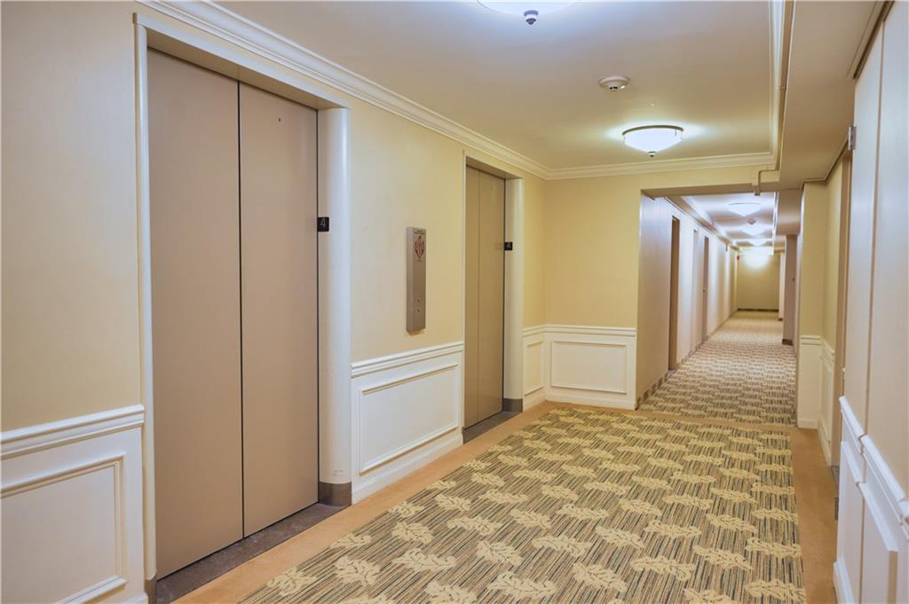 4625 Fifth Avenue, Unit 408 Pittsburgh, PA 15213 - Photo 5 of 34 a view of a hallway with wooden floor and cabinet